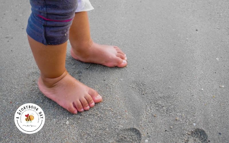 toddler feet on the beach